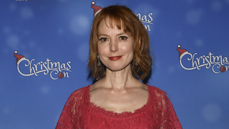 Alicia Witt posing at an event