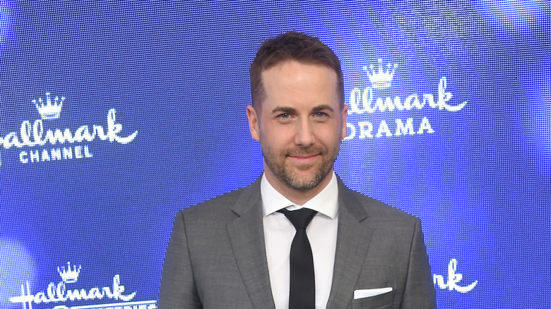 Niall Matter posing at a Hallmark event