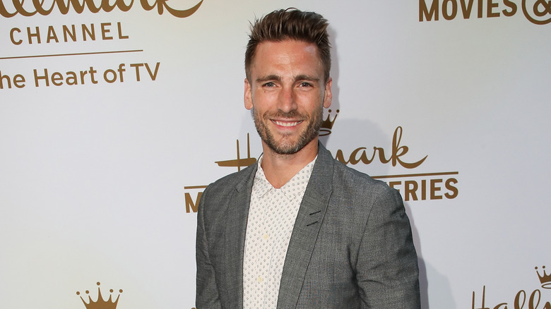 Andrew Walker smiling at red carpet event