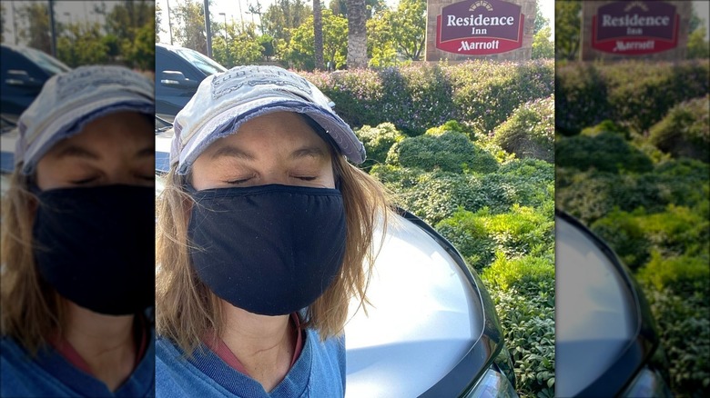 Ashley Williams posing in front of hotel