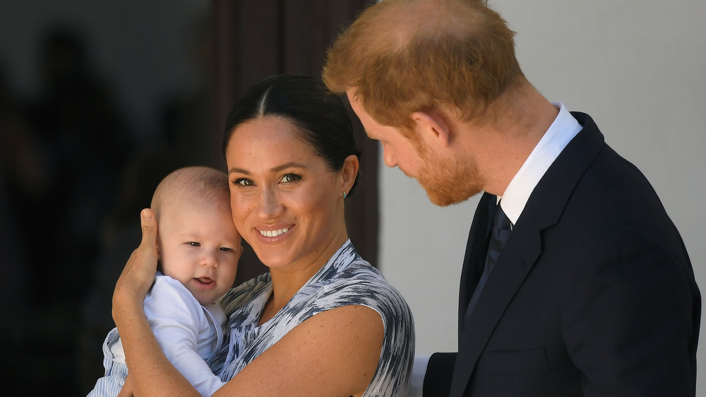 Meghan cradles Archie during a South African tour in 2019