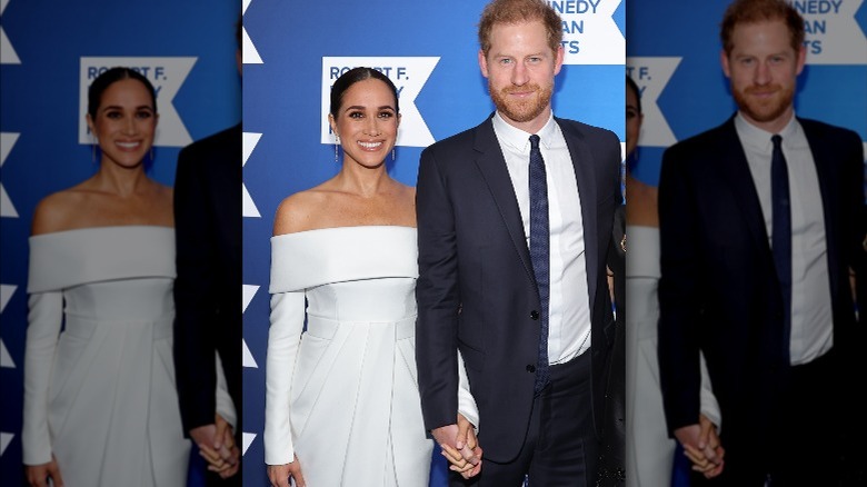 Meghan Markle and Prince Harry posing