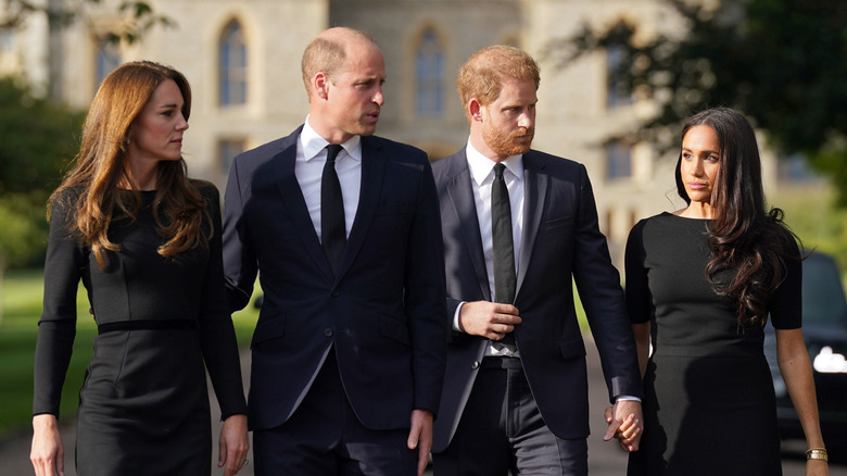 Prince William, Kate Middleton, Prince Harry, and Meghan Markle walk