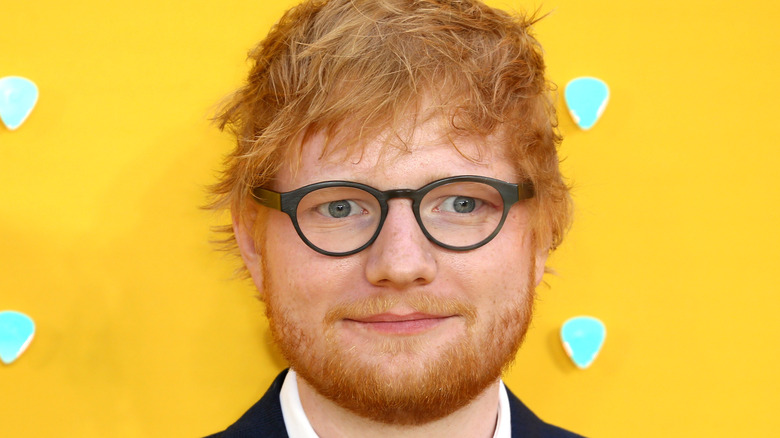 Ed Sheeran smiles on red carpet