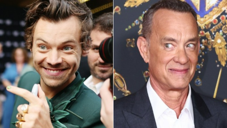 Harry Styles grinning, Tom Hanks glancing to side