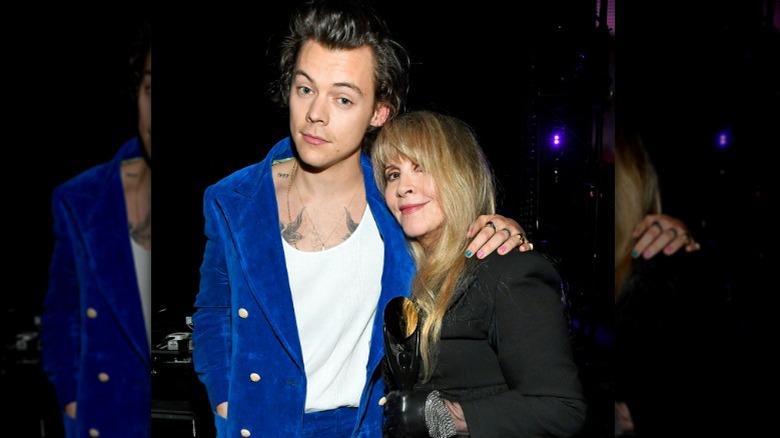 Harry Styles with arm around Stevie Nicks