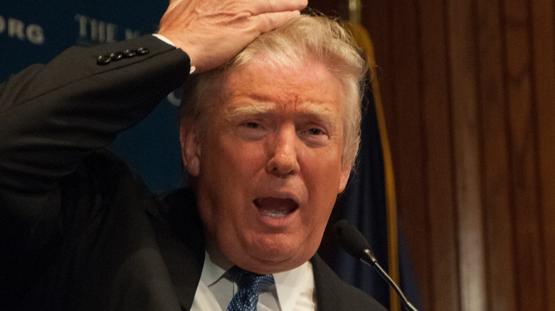 Donald Trump attempting to put hair rumors to rest