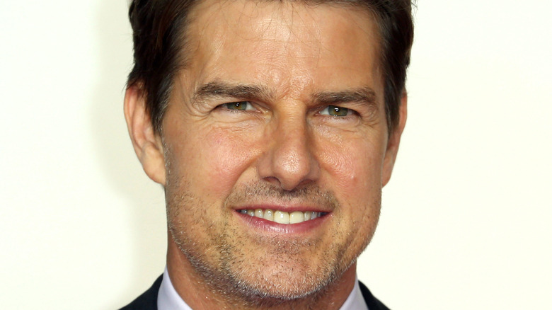 Tom Cruise smiling slightly