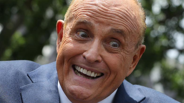 Rudy Giuliani looks manic at an event