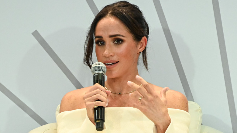 Meghan Markle talking into a microphone