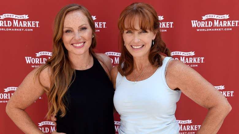 Karen E. Laine posing at an event with daughter Mina Starsiak Hawk