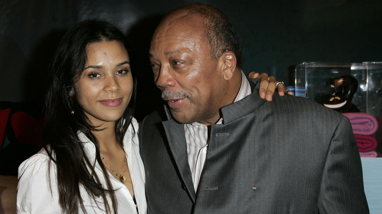 Kidada Jones with her arm around Quincy Jones