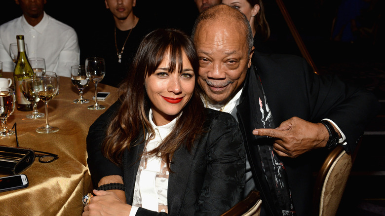 Quincy Jones with his arm around Rashida Jones