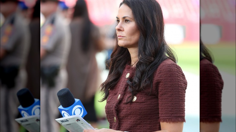 Tracy Wolfson standing on football sidelines 