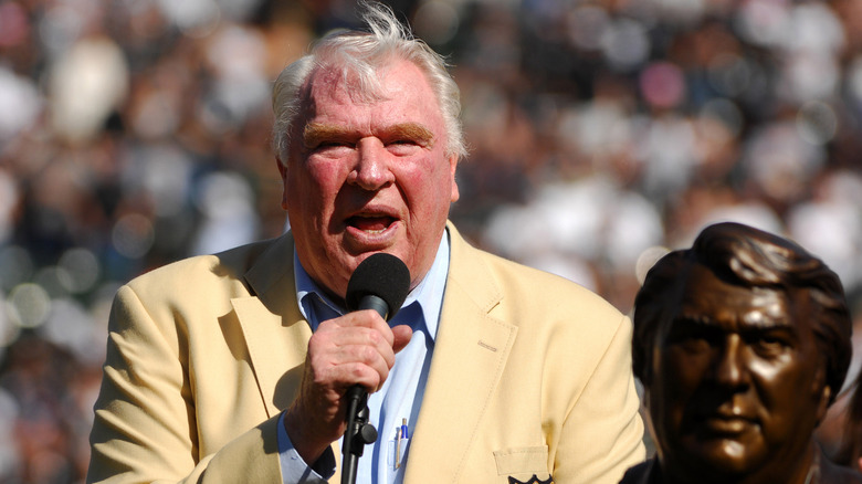 John Madden speaking on the field