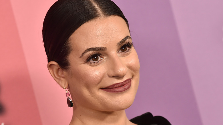 Lea Michele smiling on red carpet 