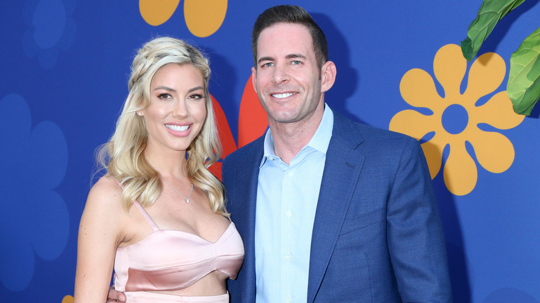 Tarek El Moussa and Heather Rae Young pose 