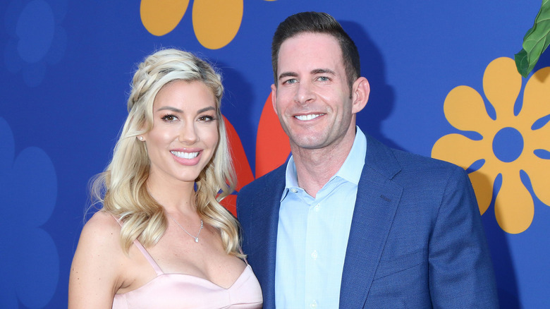 heather Rae Young and Tarek el Moussa walk the red carpet 