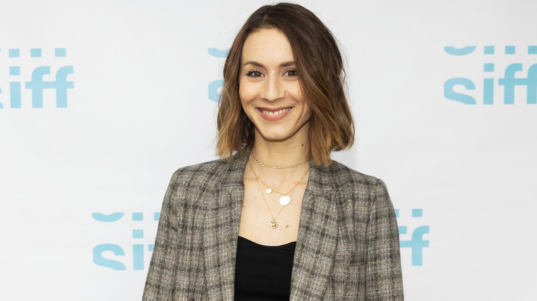 Troian Bellisario smiling on the red carpet