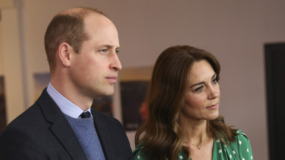 Prince William and Kate Middleton listen to a local band during a meeting with Galway Community Circus performers