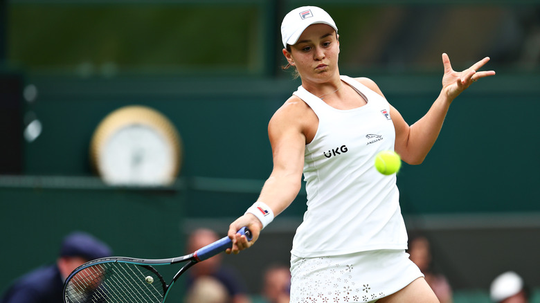 Ashleigh Barty hitting tennis ball at Wimbledon 2021