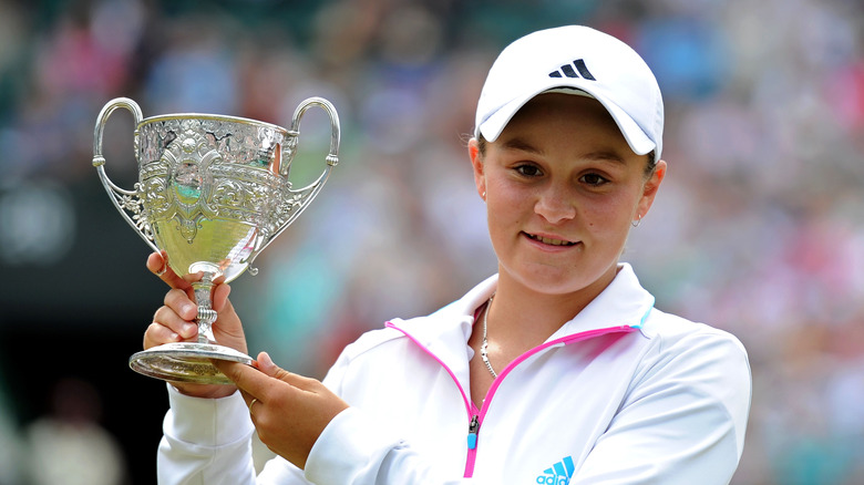 Ashleigh Barty holding trophy at Wimbledon 2021