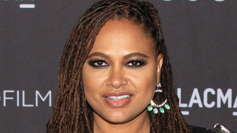 Ava DuVernay wearing silver earrings