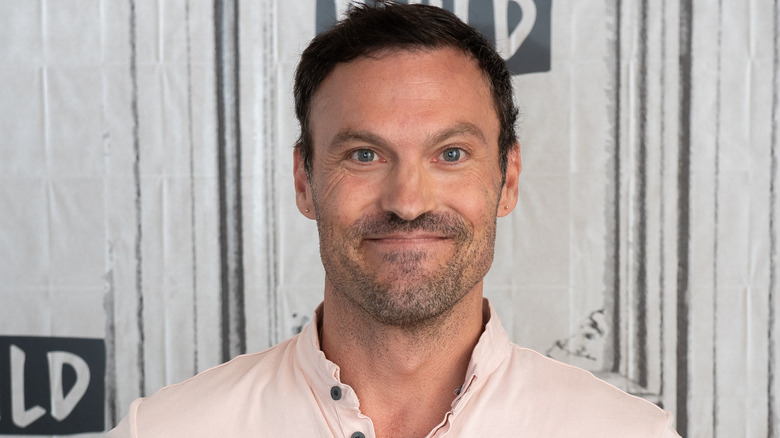 Brian Austin Green smiling with his lips closed