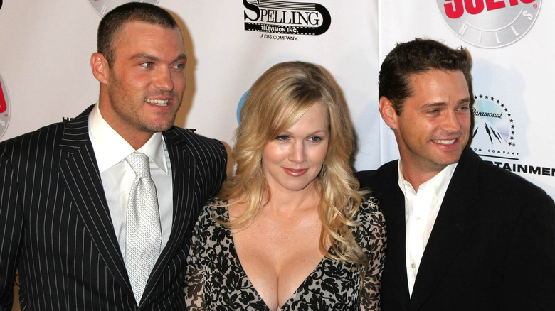 Brian Austin Green posing with Jennie Garth and Jason Priestley