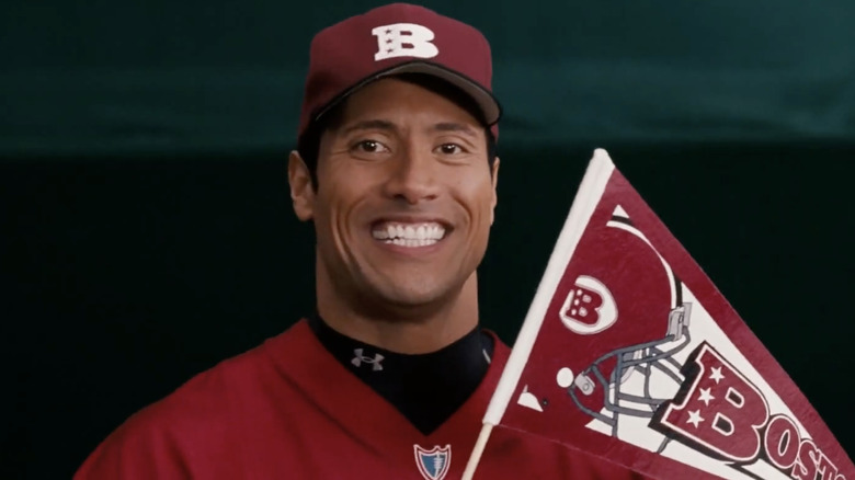 Dwayne Johnson in character for The Game Plan, posing with Boston Rebels gear