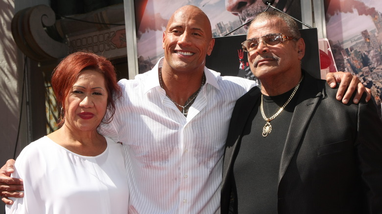 Dwayne, Ata, and Rocky Johnson smiling