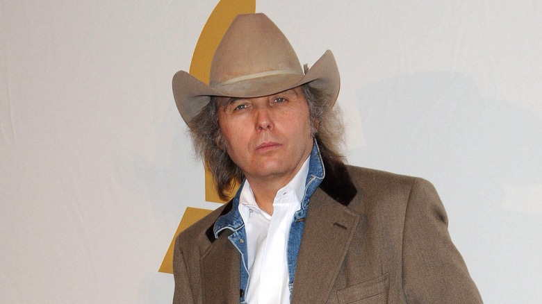 Dwight Yoakam leaning