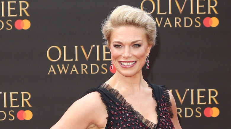 Hannah Waddingham smiling with hair up