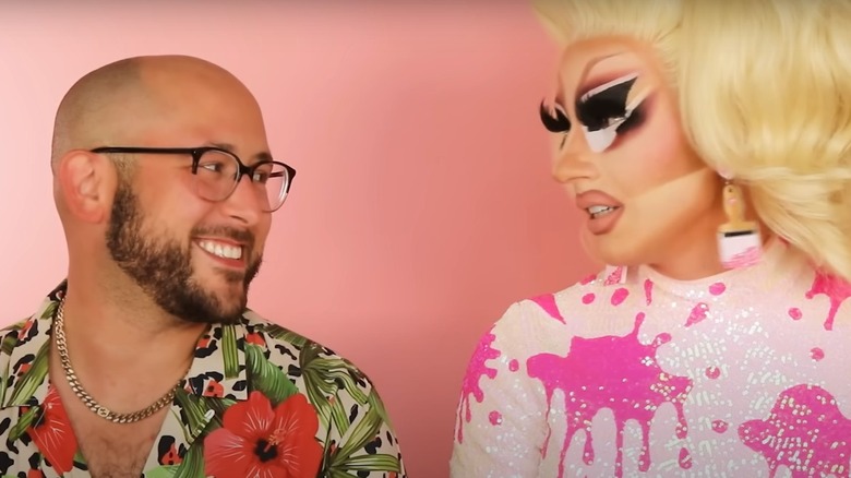 David Silver smiling at Trixie Mattel talking