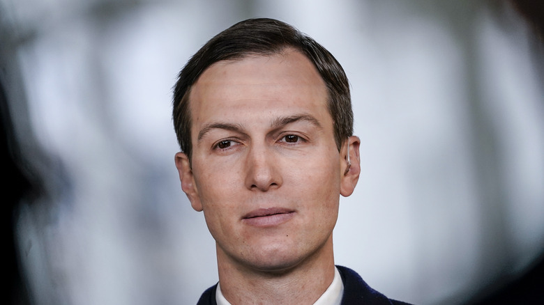 Jared Kushner wearing an ear piece