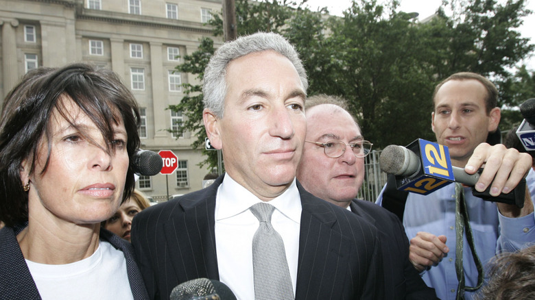 Charles Kushner surrounded by media