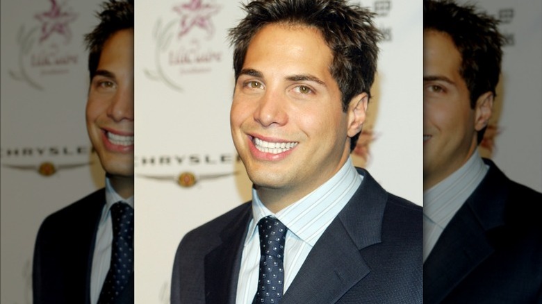 Joe Francis in suit with spiky hair