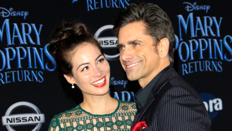 Caitlin McHugh and John Stamos smiling