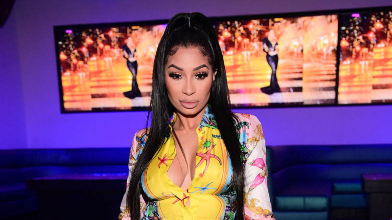 Karlie Redd, not smiling, 2021 photo, wearing a yellow dress