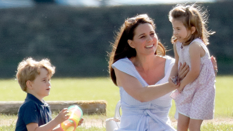Kate Middleton and her children at an event 