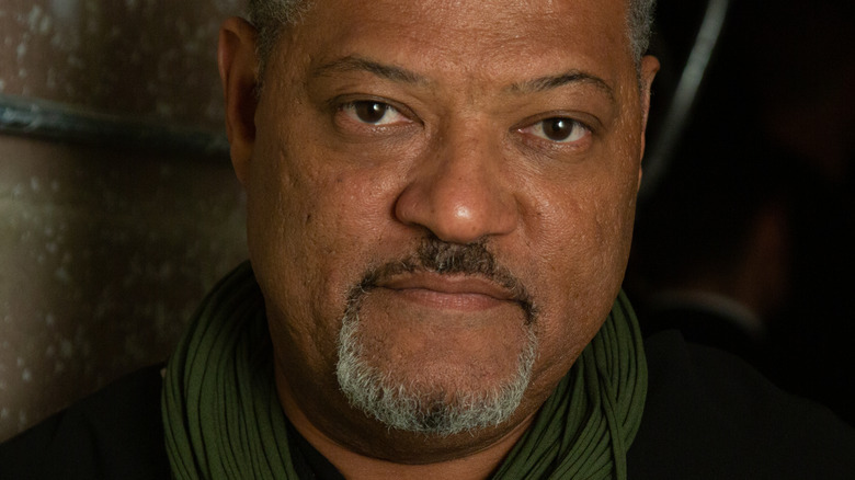 Laurence Fishburne wearing a green scarf