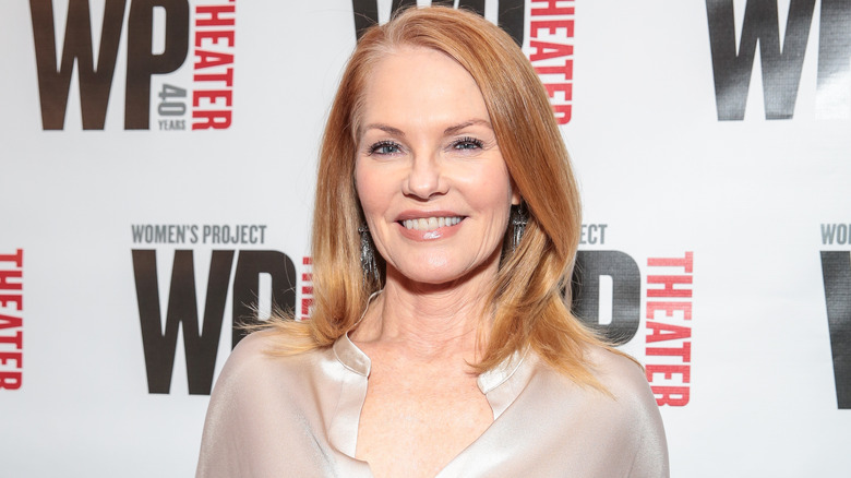 Marg Helgenberger wearing chandelier earrings