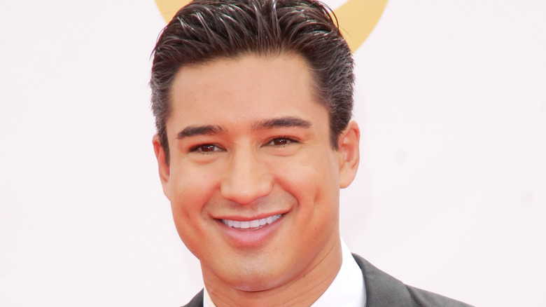 Mario Lopez smiles on the red carpet