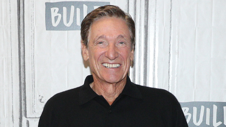 Maury Povich wearing a black shirt