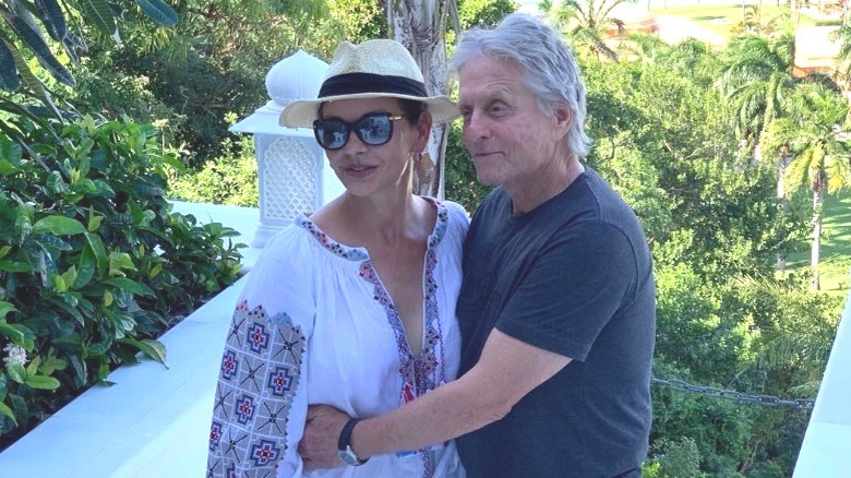 Michael Douglas and Catherine Zeta-Jones embracing