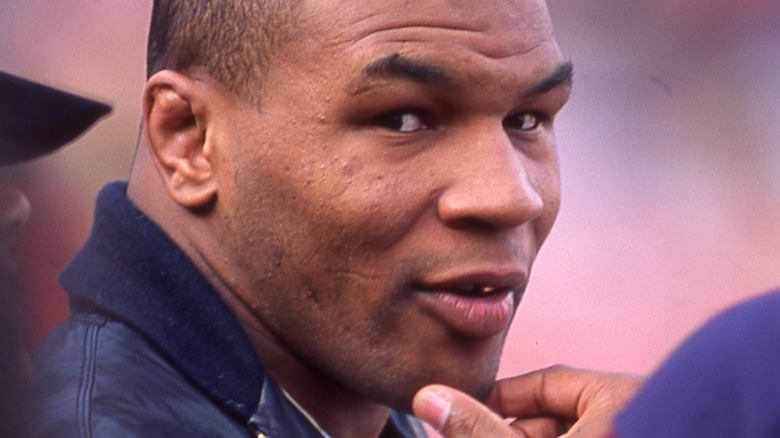 Mike Tyson with his hand on his chin