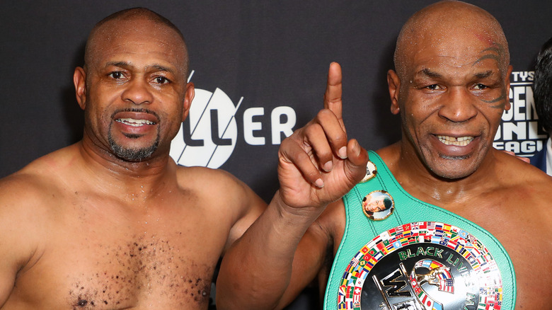 Mike Tyson posing with Roy Jones Jr.