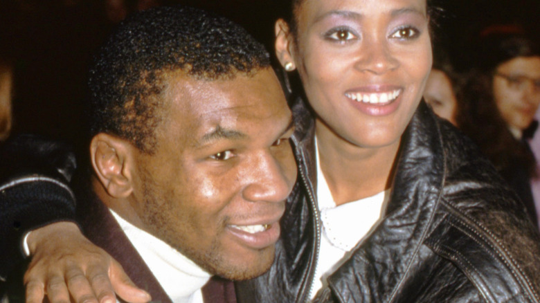 Mike Tyson posing with Robin Givens