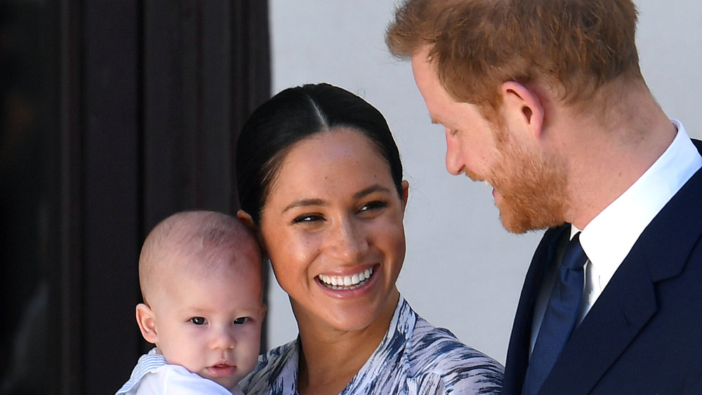 Prince Harry, Meghan Markle, and Archie smiling