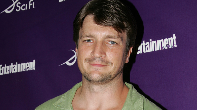 Nathan Fillion posing